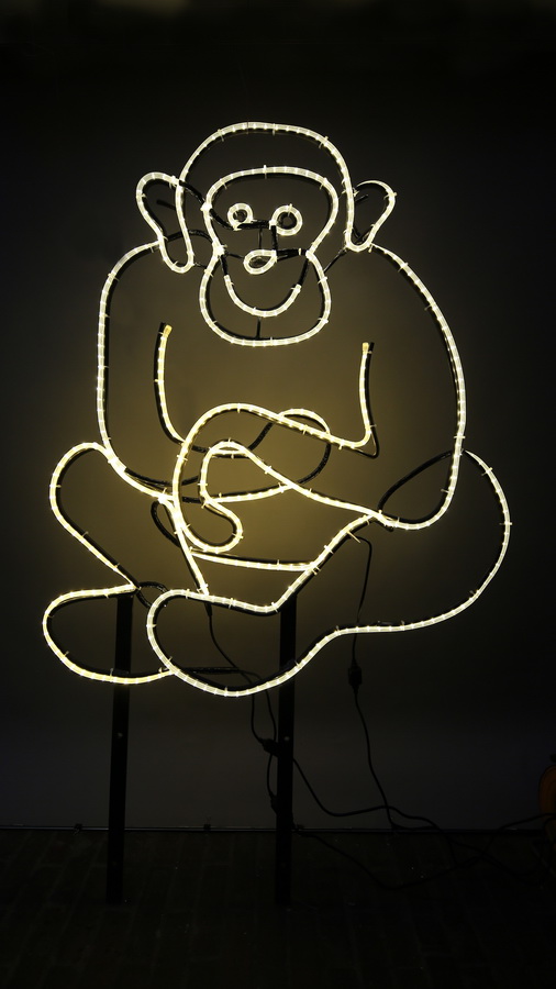 Sitzender, leuchtender Affe aus Rundeisen und LED Lichtschlauch - Leuchtender Affe