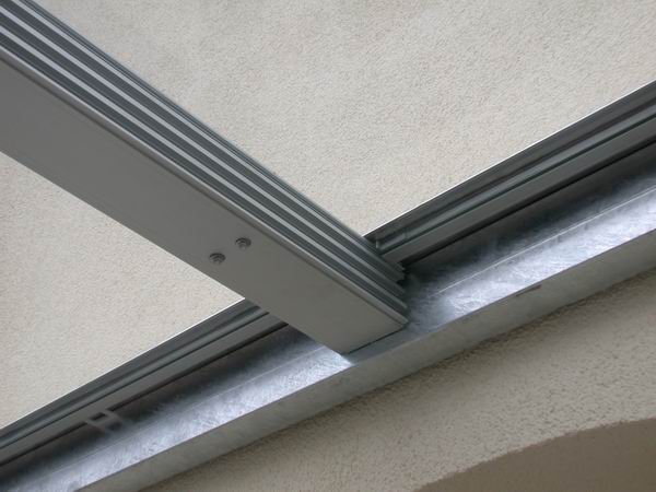 Glas Schiebedach - Terrassenüberdachung mit Glasfüllung für einen Balkon im 5. Stock