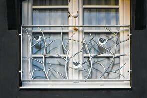 handgeschmiedetes Fenstergitter mit 3 Vögeln