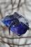 Glas Blume aus Eisen und farbigem Glasbrocken
