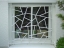 Fenstergitter mit "Schmitz Struktur" weiß lackiert