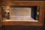 Einbaugehäuse mit Klingelknopf aus Tombak und Edelstahl für ein Bedienfeld einer Alarmanlage