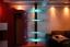 Beleuchtetes, drehbares Regal aus Edelstahl und Glas mit LED beleuchtete Glasböden