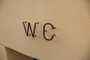 Schriftzug WC aus Tombak