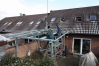 Montage eines Terrassen Dach aus feuerverzinktem Stahl und Sicherheitsglas
